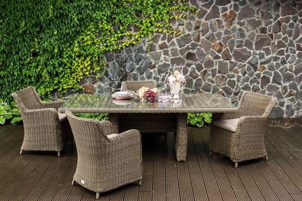 Armchair Wicker Seat Dining Table Outdoor Furniture Stone Wall Background — Stock Photo, Image