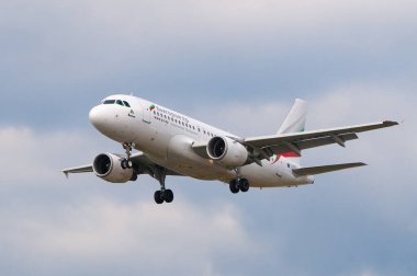 London, Uk - August 9, 2023 - Bulgaria Air Airbus A319-112  landing at Heathrow airport clipart