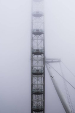 London, Uk - October 19, 2024 - The London Eye partially shrouded in fog clipart