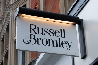 London, Uk - October 19, 2024 - Russell & Bromley store sign in Oxford Street, London clipart