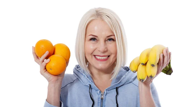 Happy Woman Blond Hair Beautiful Smile Holds Two Oranges Bananas — Stock Photo, Image