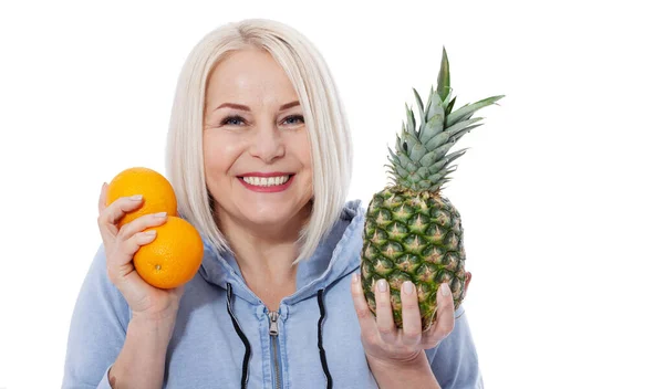 Happy Woman Blond Hair Beautiful Smile Holds Two Oranges Pineapple — Stock Photo, Image