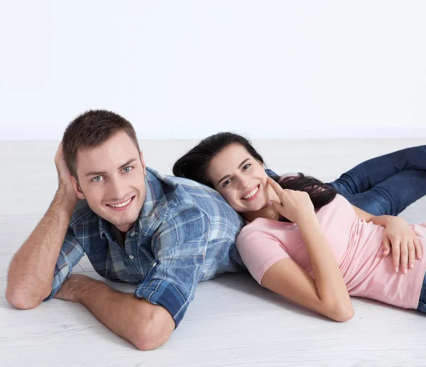 Happy Young Couple Lying Floor Look Each Other Dream Furniture Stock Picture