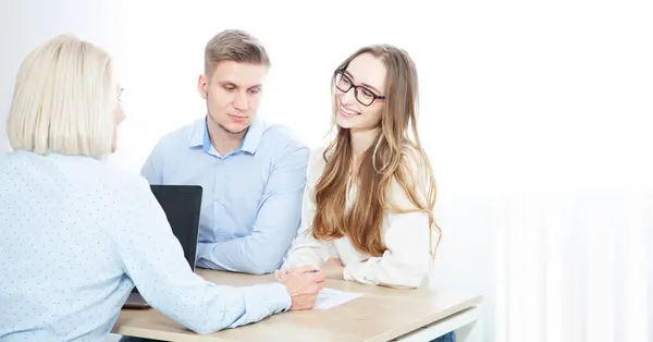 Knowledgeable Woman Realtor Consults Young Couple Property Acquisition Her Office Stock Image