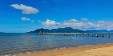 Pier or jetty at a small coastal tourist town in North Queensland Australia clipart