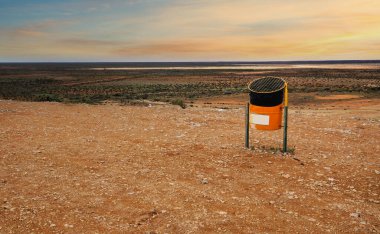 View of the Woodleigh Impact Crater it is a large meteorite impact crater in Western Australia, near Shark Bay, and is considered one of the biggest impact craters in Australia. view of trash can to help keep tourist area clean clipart