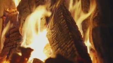 Burning firewood in an old rustic oven close-up