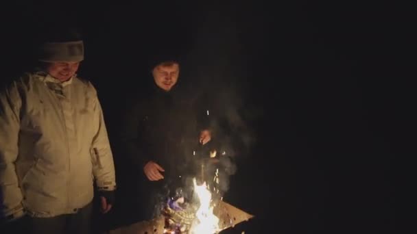 Two Young Guys Front Barbecue Communicate Lighting Fire Cooking Dinner — Wideo stockowe