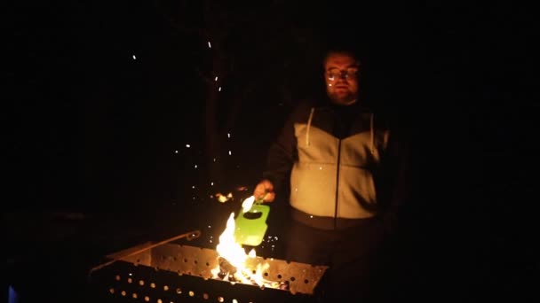 Large Man Kindles Fire Brazier Dark Evening Open Air — Stock Video
