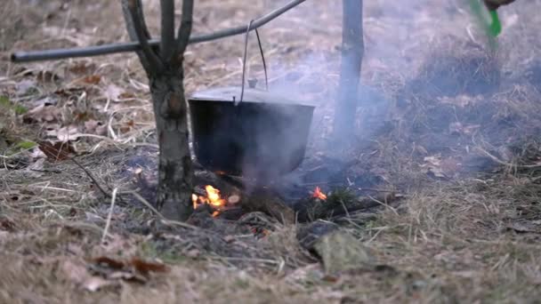 Man Blows Fire Food Being Cooked Cauldron Plastic Spatula Slow — Stock Video