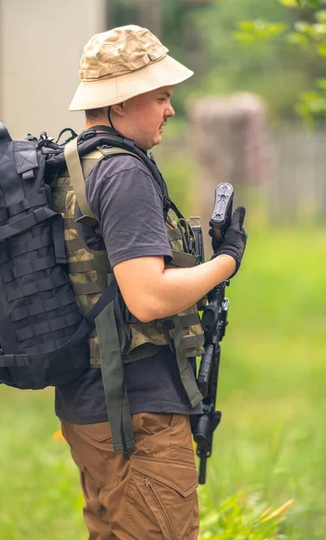 Lightly Armed Man Stands Holding Rifle Butt — Fotografia de Stock
