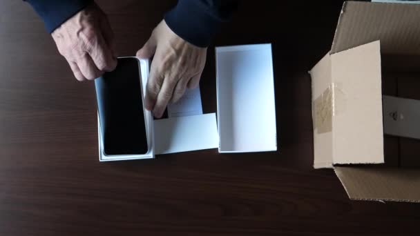 Unpacking Brand New Cellphone Smartphone Hands Removing Protective Film Shiny — Stok video