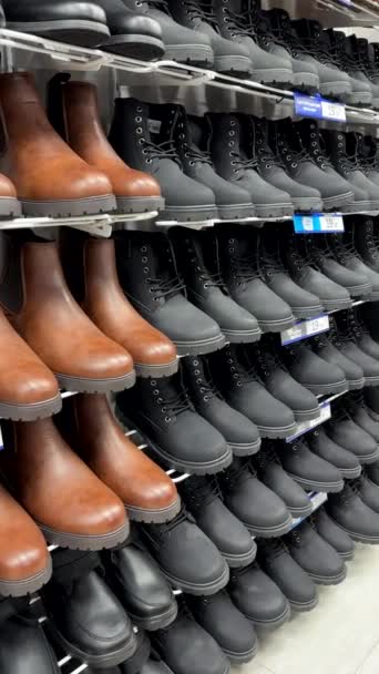 Vertical Panning Shot Black Brown Boots Display Men Footwear Department — Stock Video
