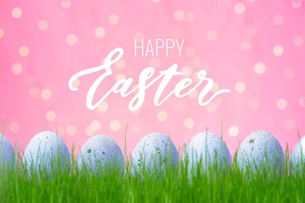 Concept Easter Egg Hunt Pink Background Decorated Lilac Eggs Grass Foto Stock