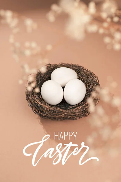 Easter Concept Happy Easter Lettering Eggs Beige Background Nest Containing lizenzfreie Stockfotos