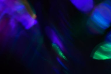 Soyut bulanık lensler siyah renkte parlıyor.