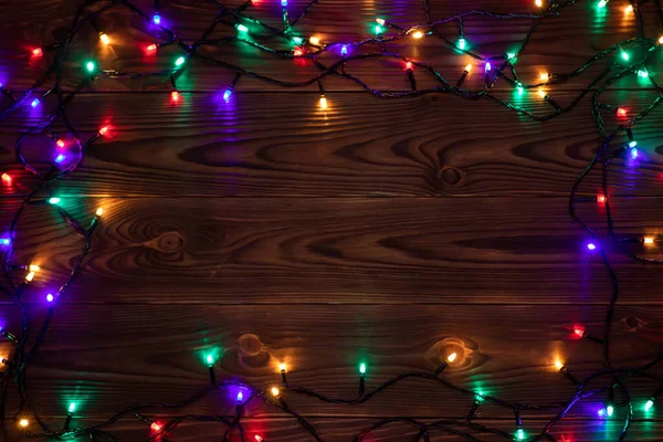 Weihnachtsbeleuchtung Hintergrund Kopierraum Urlaub Glänzende Girlanden Rand Draufsicht Auf Braunen — Stockfoto