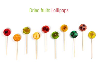Lollipops with dry fruits inside on a white background. Healthy sweetness, benefits of natural fruits. Collection.