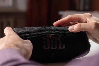 Dnioro Ukraine. 27 january 2023: Bluetooth speaker on hand. man use portable speaker.
