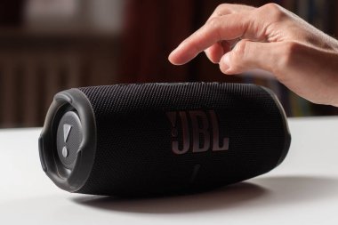 Dnioro Ukraine. 27 january 2023: Bluetooth speaker on hand. man use portable speaker.