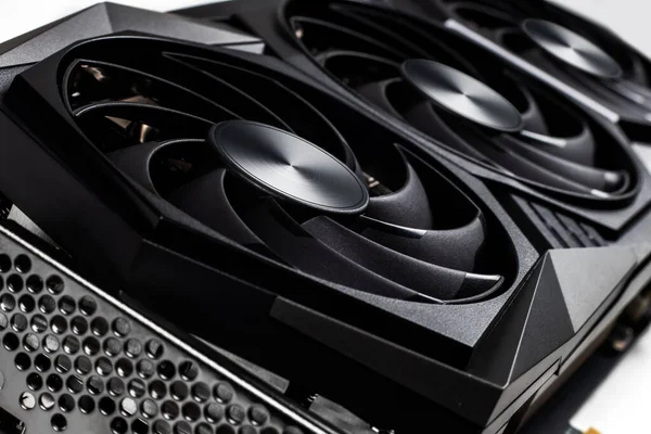 Video Graphics card with powerful GPU on white background. Professional video card for computer. Closeup photo with shallow depth of field.