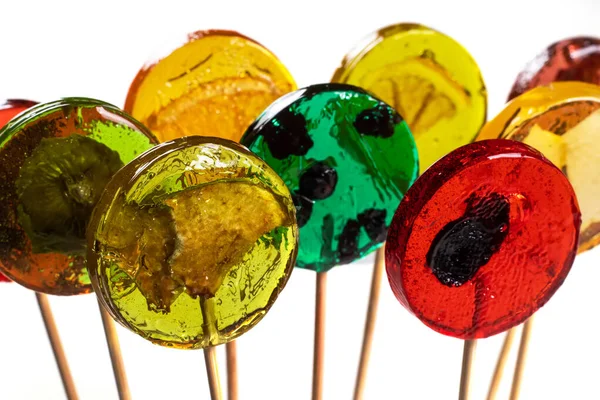 stock image Lollipops with dry fruits inside on a white background. Healthy sweetness, benefits of natural fruits