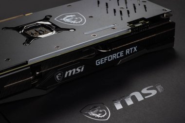 UKRAINE, DNIPRO, FEBRUARY 23, 2023: MSI Geforce RTX grafik kartı, PC veya madencilik platformu için donanım parçaları. Arkaplan