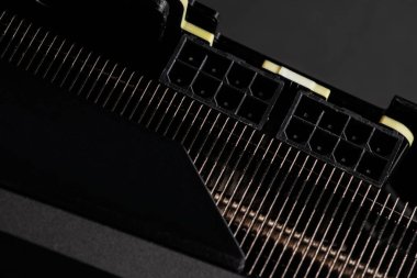 2 ports of 8 pins of power supply of the video card together with a cooling radiator close-up.