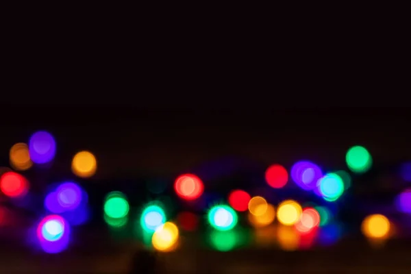 圣诞彩灯的明亮的圆形背景 — 图库照片