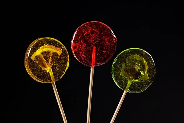 Sweet Colorful Lollipops Dried Fruits Black Background — Stockfoto