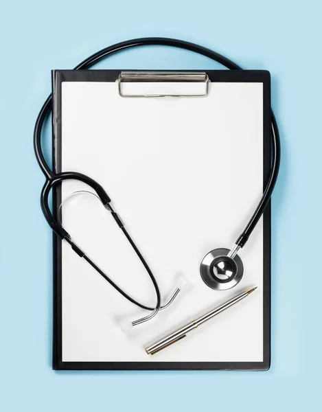 blank clipboard with modern stethoscope, space for messages.