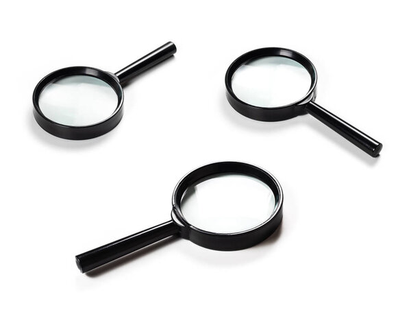 magnifying glass with black handle on white background. closeup photo side view. collection