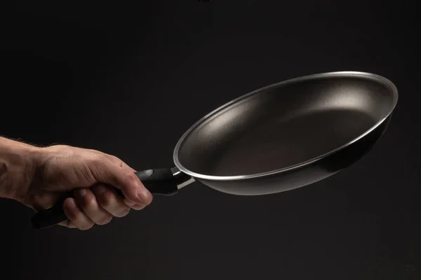 Hand Holding Frying Pan Dark Background — Stock Photo, Image