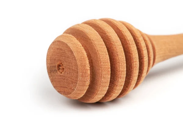 白い背景に単離された木製の蜂蜜スプーン — ストック写真