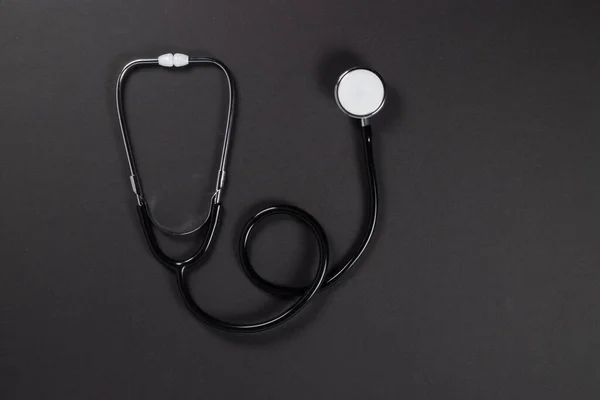 Zwarte Stethoscoop Donkere Achtergrond Gezondheidszorg Copcept — Stockfoto