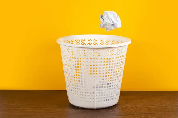 Throw it in the waste paper basket or bin concept for business frustration, stress and writers block.