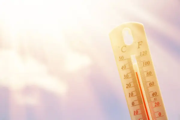 Thermometer. Summer heat or global warming climate change concept