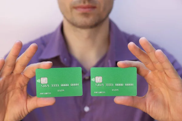 man holding credit cards close up