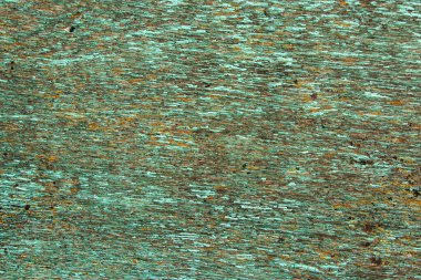 Çatlak boyalı, arka plan desenli eski yeşil ahşap bir duvar. Yüksek kalite fotoğraf.