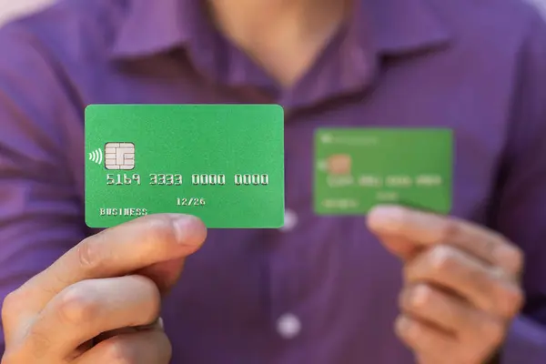 man holding credit cards close up