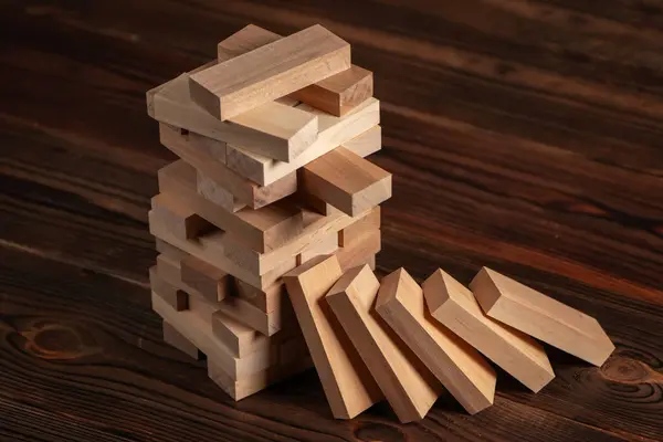 Blocks wood game with copy space, The tower from wooden blocks from the top view, Jenga, Businessman manage his strategy, Concept of education, risk, development, and growth