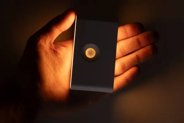 small solar night led light with motion sensor in the hand