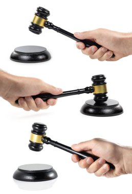 Hand hold judges gavel on sounding block on white background. clipart