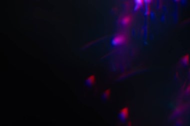 Soyut bulanık lensler siyah renkte parlıyor.