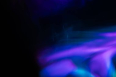 Soyut bulanık lensler siyah renkte parlıyor.