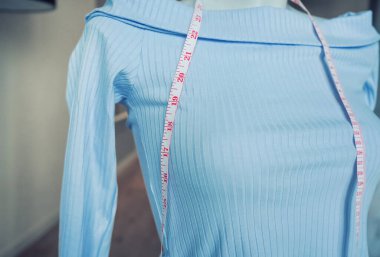mannequin and measuring tape. Sewing at home. Startup sewing clothes.