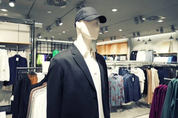 Male mannequin in a men\'s clothing store. Shopping centers