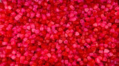 Bright red Jube heart candies with a metal scoop. Concept of heart, Valentine Day, sweetness, love, celebration, sweet treats. clipart