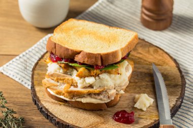 Homemade Thanksgiving Leftover Turkey Sandwich with Cranberry Stuffing and Potatoes clipart