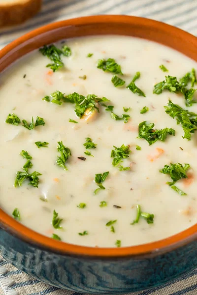 Homemade Creamy Clam Chowder Soup with Bread and Parsley